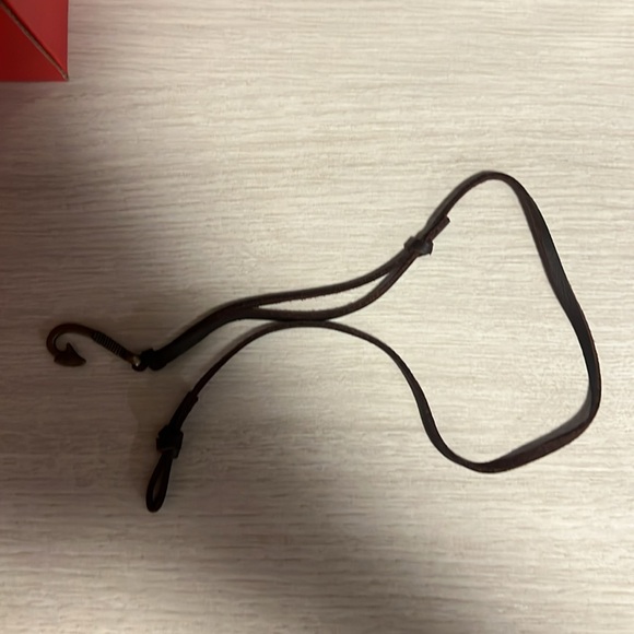 Never worn leather wrist wrap with small hook.  It is 17in in length - Picture 1 of 4